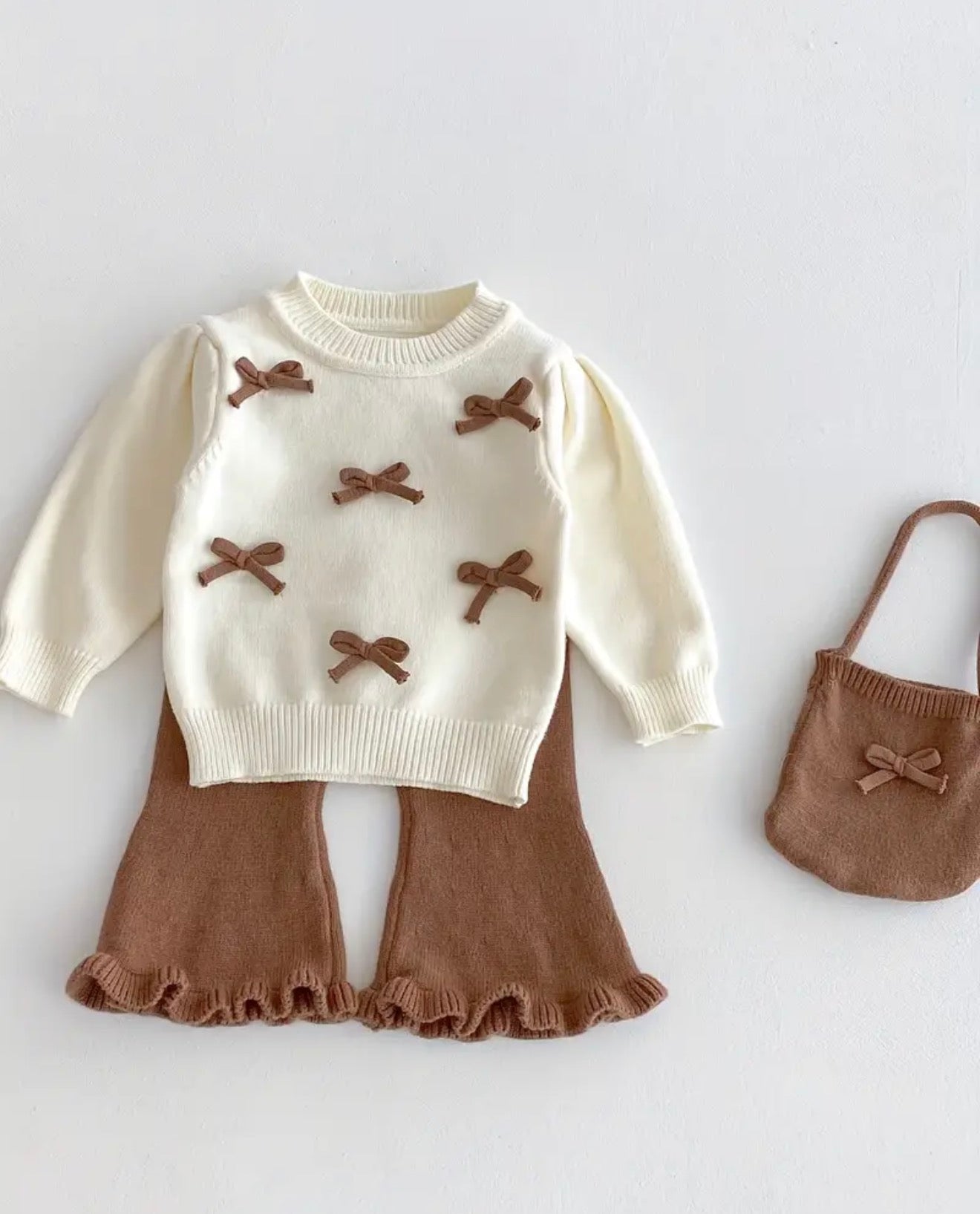 Kledingsetje baby met strikjes